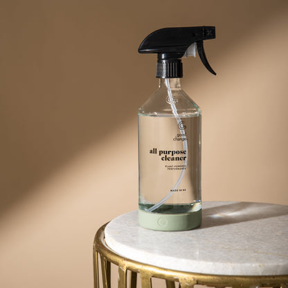 All-purpose cleaner bottle on a marble surface with a beige background