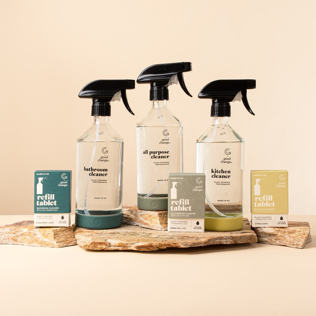 Set of cleaning products including glass spray bottles and refill tablets for modern design cleaning products